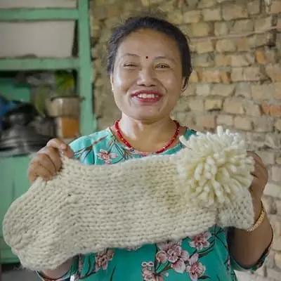 A female artist displays wool garment