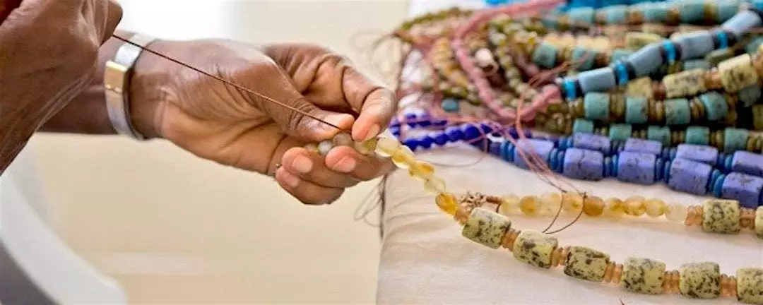 Artist hand-making jewelry.
