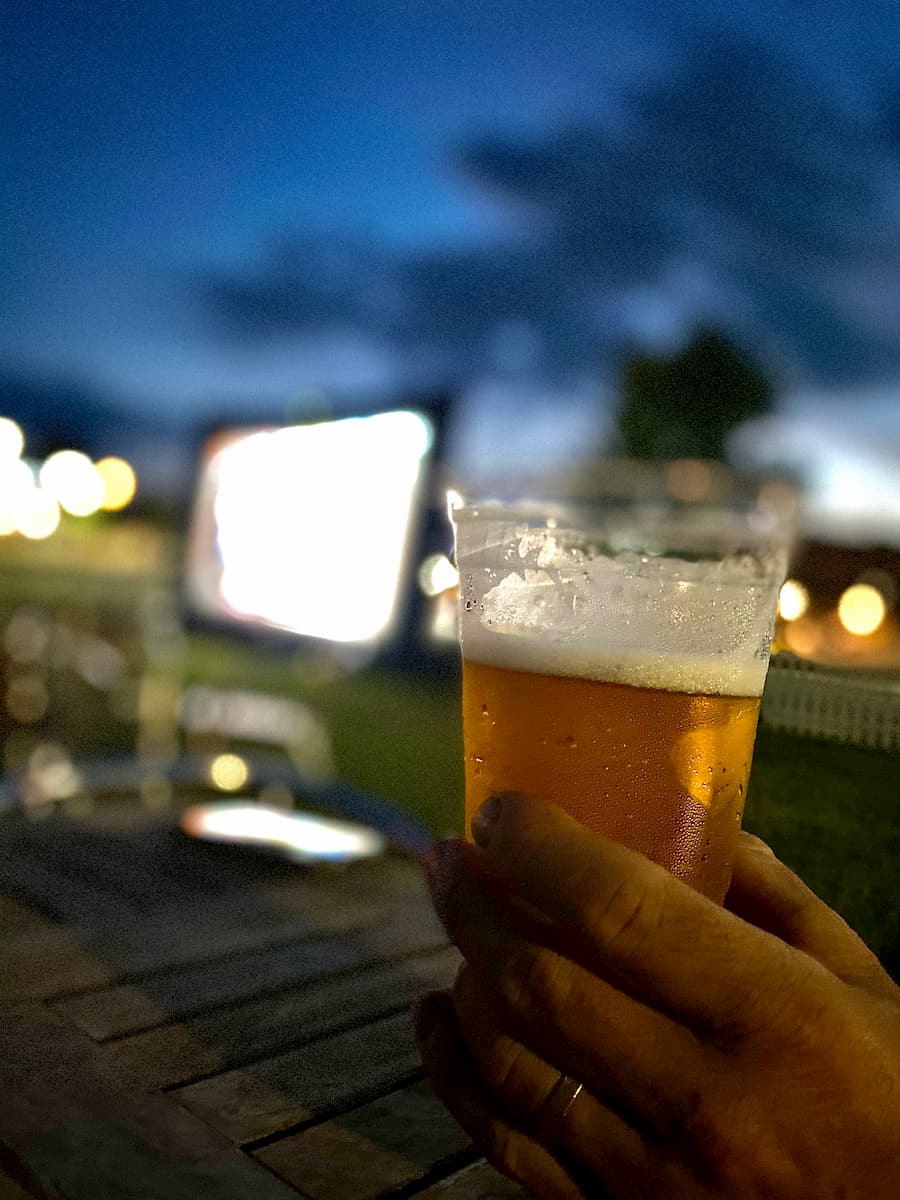 craft beer in front of large screen