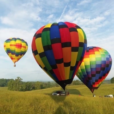 Hot air balloons floating by.