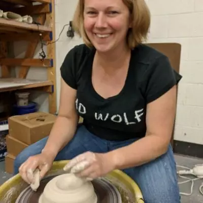 Artist making pot.