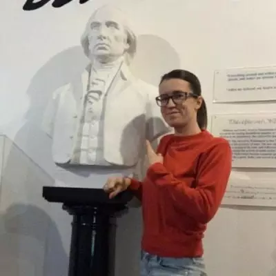 Jess Cifizzari with bust of James Madison.