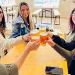 5 girls toast with pints