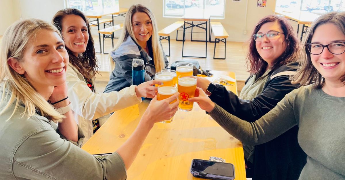 5 girls toast with pints