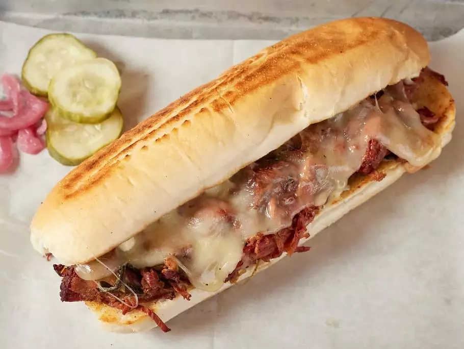 The ILLY Cheesesteak with brisket, onions, provolone, and more at Vision BBQ