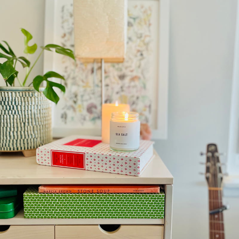 Adding an assortment of candles to any nook offers a warm and inviting feeling for a living room or office.